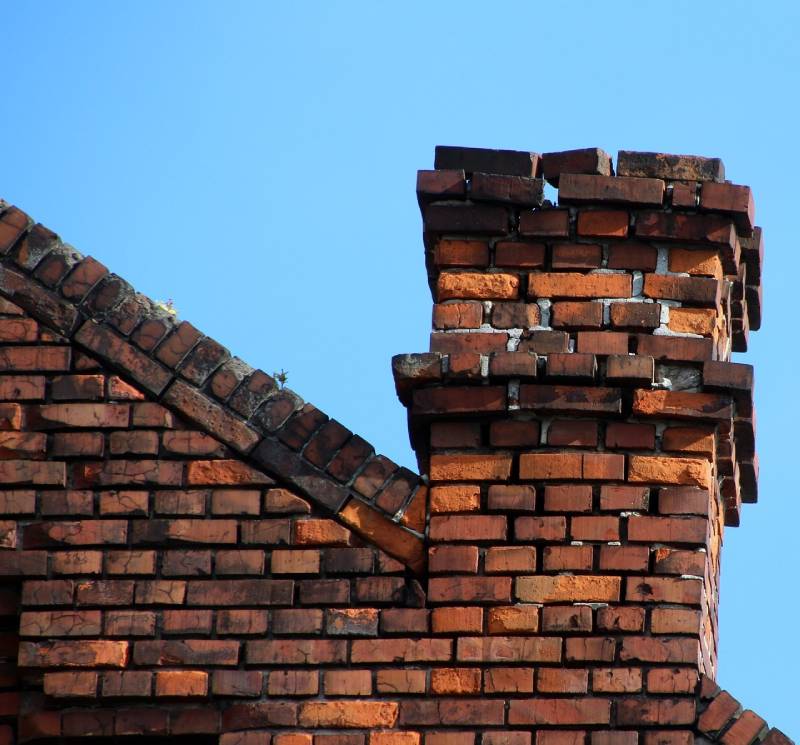 Signs Your Dolton Home Needs a Chimney Inspection Damaged chimney on an Dolton home showing cracks and missing mortar